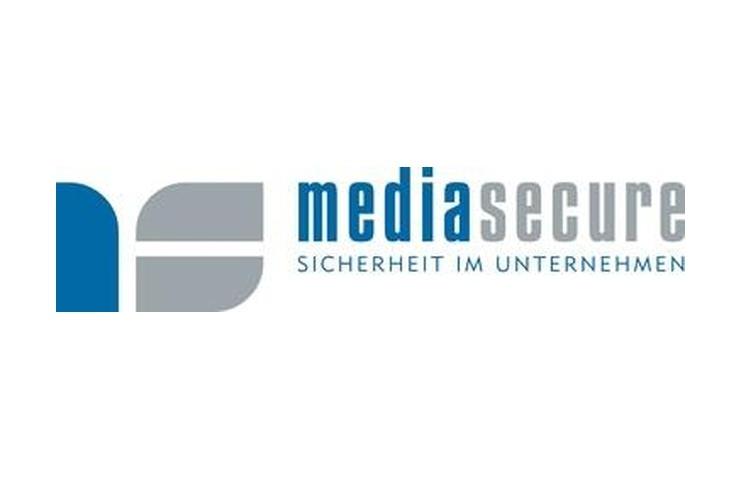 Logo von mediasecure mit Schriftzug „Sicherheit im Unternehmen“ in Grau und Blau. Geometrische Formen sind sichtbar.